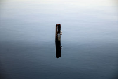 High angle view of wooden post in lake