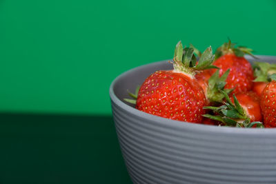 Close-up of strawberries in plate on table