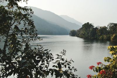 Scenic view of lake and mountains against sky