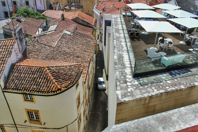 High angle view of swimming pool by buildings in town