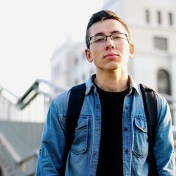 Portrait of young man standing outdoors