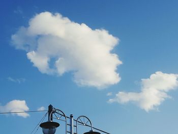 Low angle view of telephone pole against sky