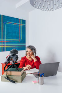 Young woman using laptop at home