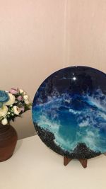 High angle view of blue water on table against wall