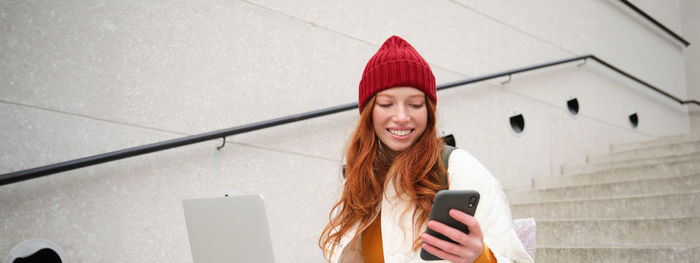 Young woman using mobile phone