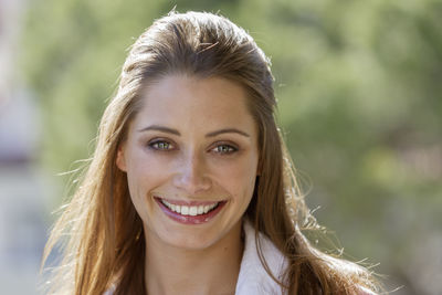 Close-up portrait of smiling woman 