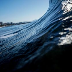 Close-up of sea water against clear sky