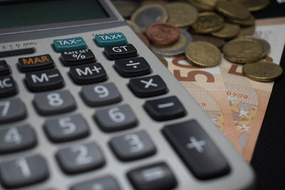 Close-up of coins on table
