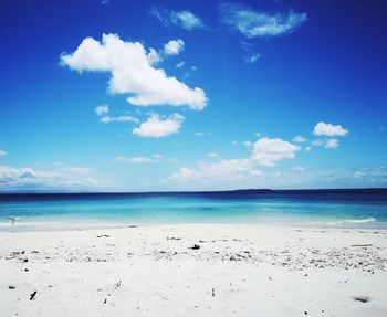 Scenic view of sea against blue sky