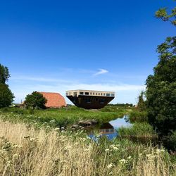 Scenic view of lake against blue sky