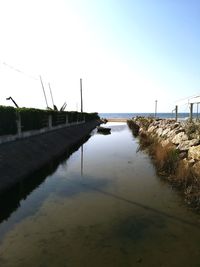 Bridge over river against sky