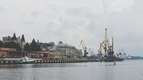 Panoramic view of river and buildings against sky