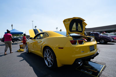 View of yellow car on street