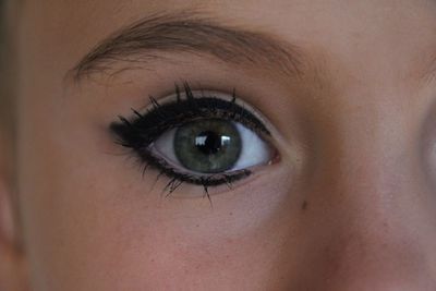 Closeup of an eye with eye-makeup.