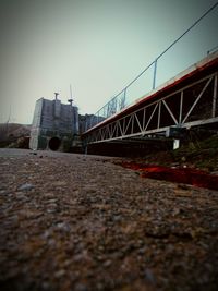 Surface level of bridge against clear sky