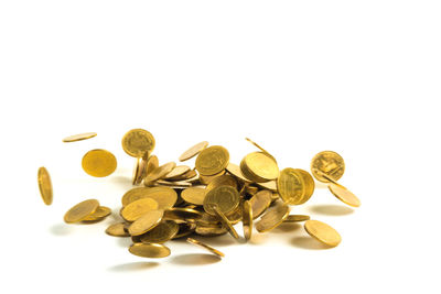 High angle view of coins on white background