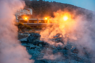 Mount unzen hell valley jigoku and hotel at night with gas steam, nagasaki, kyushu, japan. 