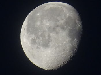 Low angle view of moon against clear sky at night