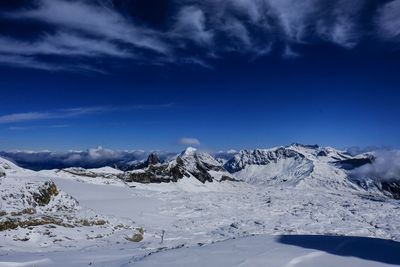 Scenic view of snowcapped mountains against sky