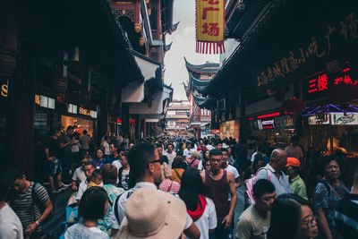 Group of people walking on city street
