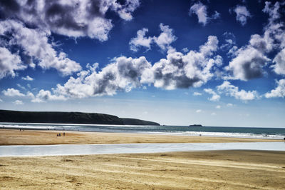 Scenic view of beach against sky