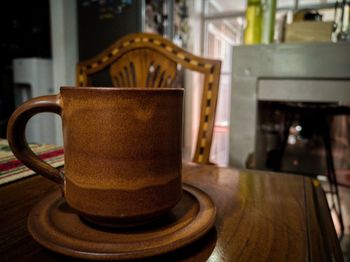 Close-up of coffee cup on table