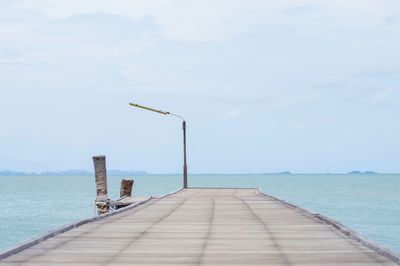 Pier over sea against sky