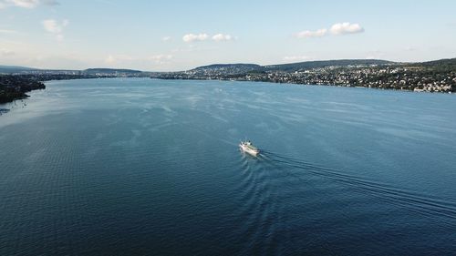 High angle view of person sailing on sea against sky