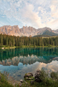 Scenic view of lake and mountains against sky