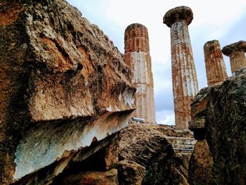 Low angle view of old ruins against sky