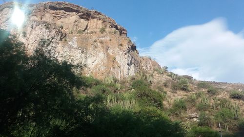 Scenic view of rocky mountains against sky