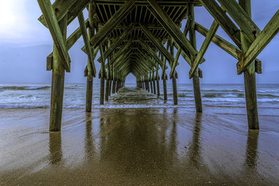 Scenic view of pier over sea against sky