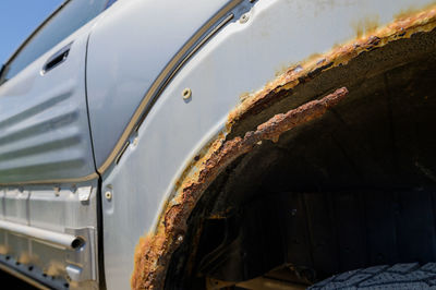 Close-up of rusty mudguard of car