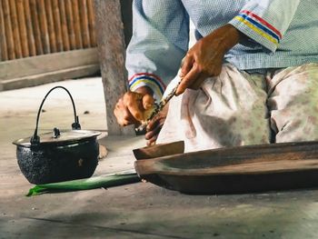 Close-up of man working on table