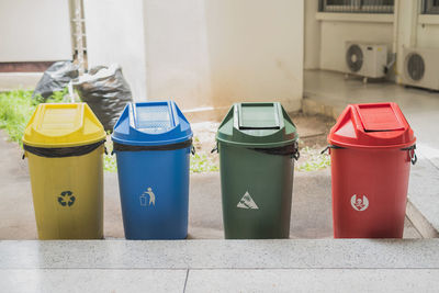 Colorful garbage bins in yard