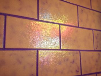 Low angle view of wet window in rainy season