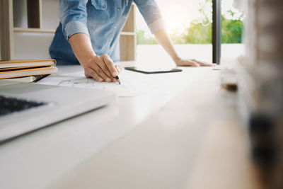 Low section of people working on table