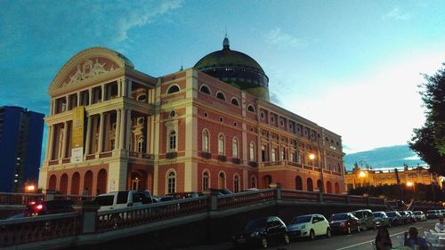 Low angle view of building against cloudy sky