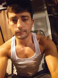 Portrait of young man sitting outdoors