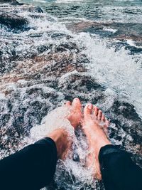 Low section of people in sea