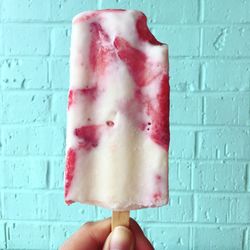 Close-up of hand holding ice cream