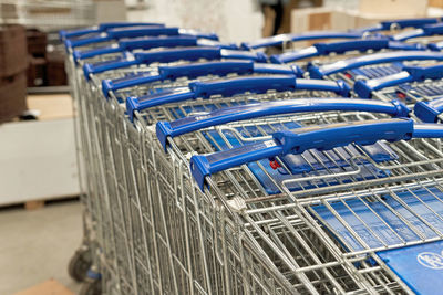 Close-up of shopping cart in row