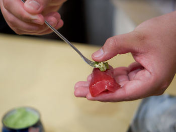 Close-up of hand holding ice cream