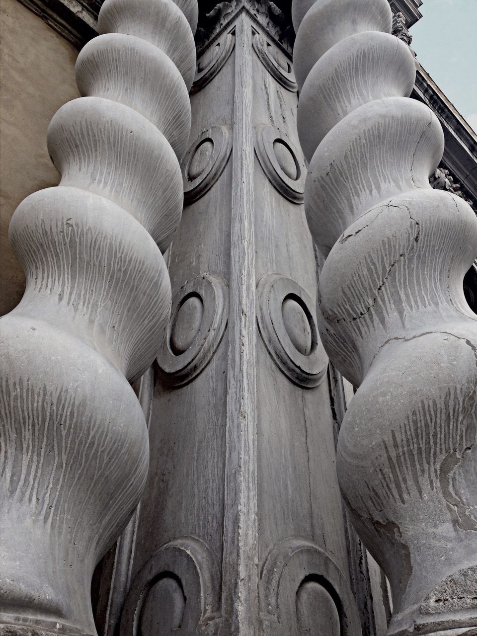 architecture, built structure, religion, place of worship, spirituality, low angle view, history, architectural column, building exterior, in a row, arch, travel destinations, repetition, no people, famous place, architectural feature, day, outdoors, sunlight