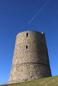 Low angle view of historical building against blue sky