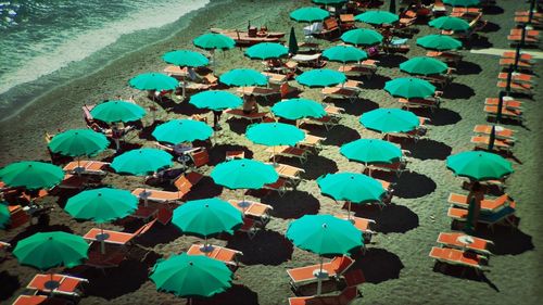 High angle view of parasols and lounge chairs on amalfi beach