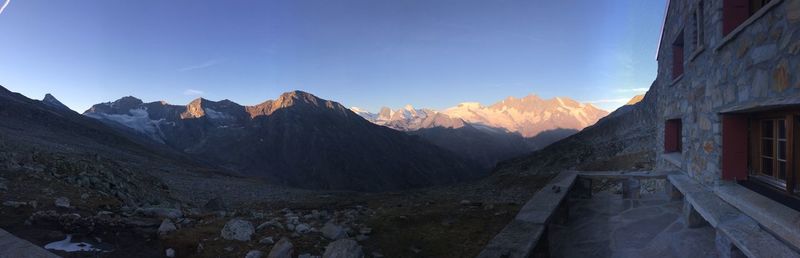 Panoramic view of houses and mountains against sky