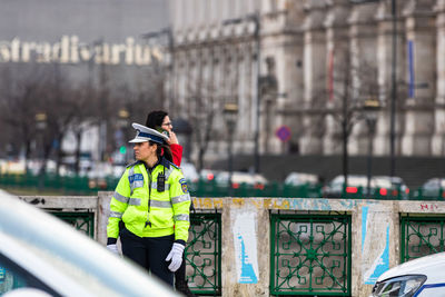 Man standing by railing