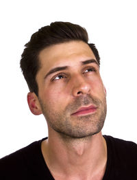 Close-up portrait of man against white background