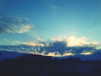 Built structures against clear sky at sunset